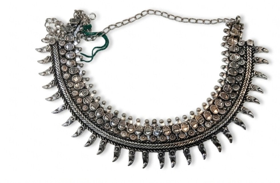 choker necklace often categorized as tribal or ethnic jewelry
